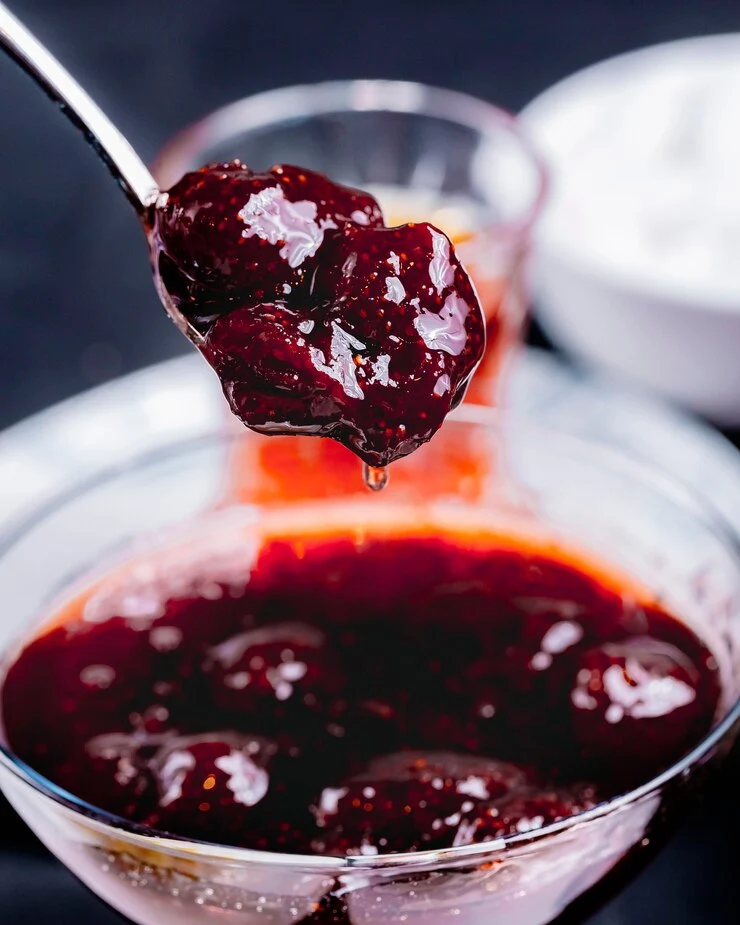 strawberry jam pouring from spoon glassware side view 141793 3198